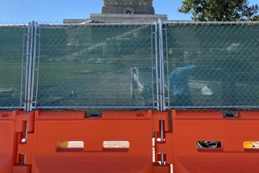 Stacked metal barricades ready for rental deployment