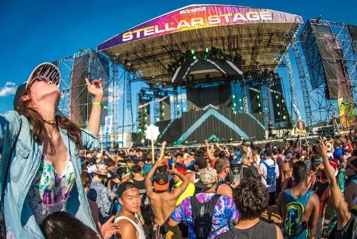 Concert crowd behind SONCO barricades at an outdoor stage