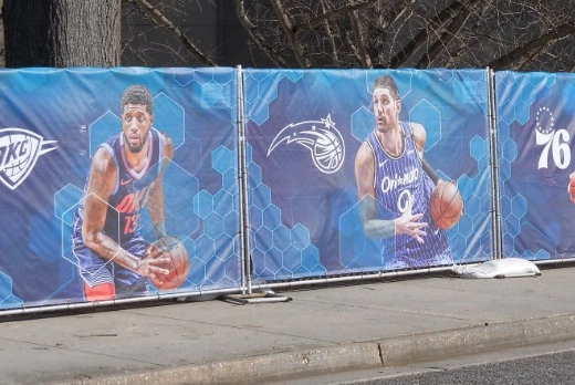 Custom printed fence wraps at a sports venue