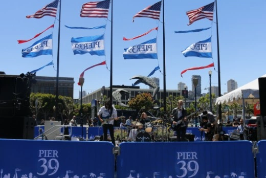 Branded crowd control barriers at a waterfront venue