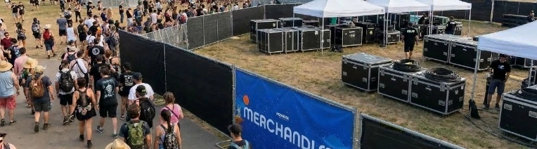 Custom privacy fence screen branding a festival perimeter